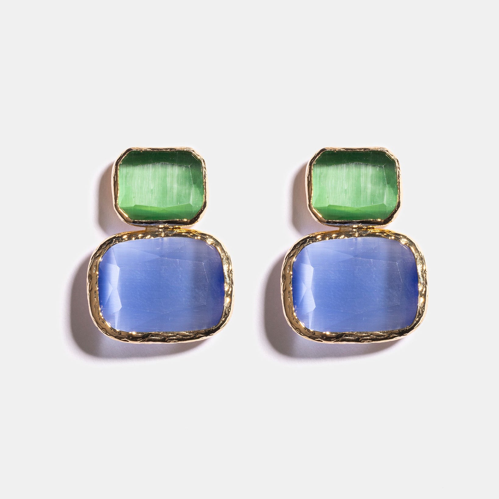 Emerald and sky blue Cat’s Eye earrings flatlay