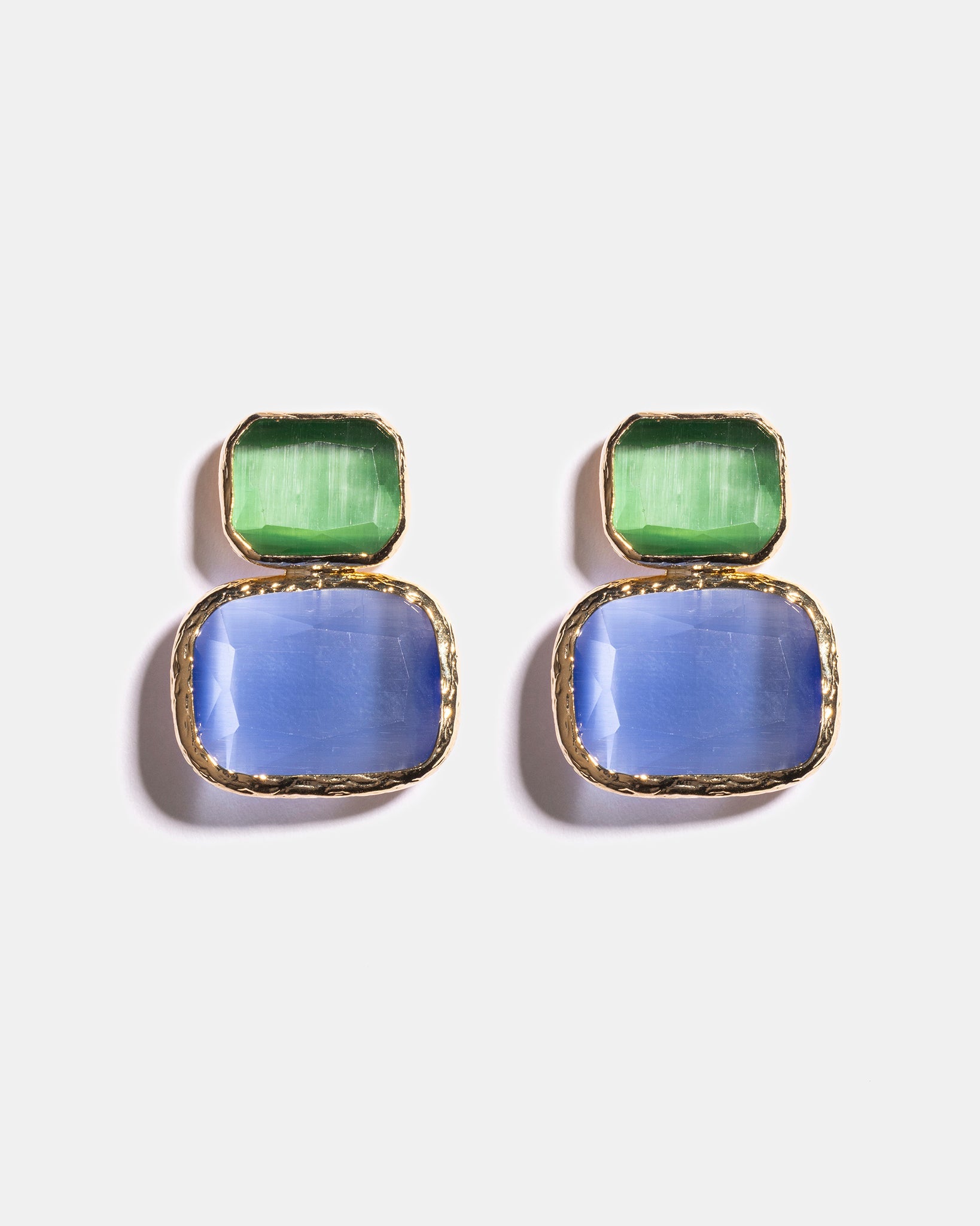 Emerald and sky blue Cat’s Eye earrings flatlay