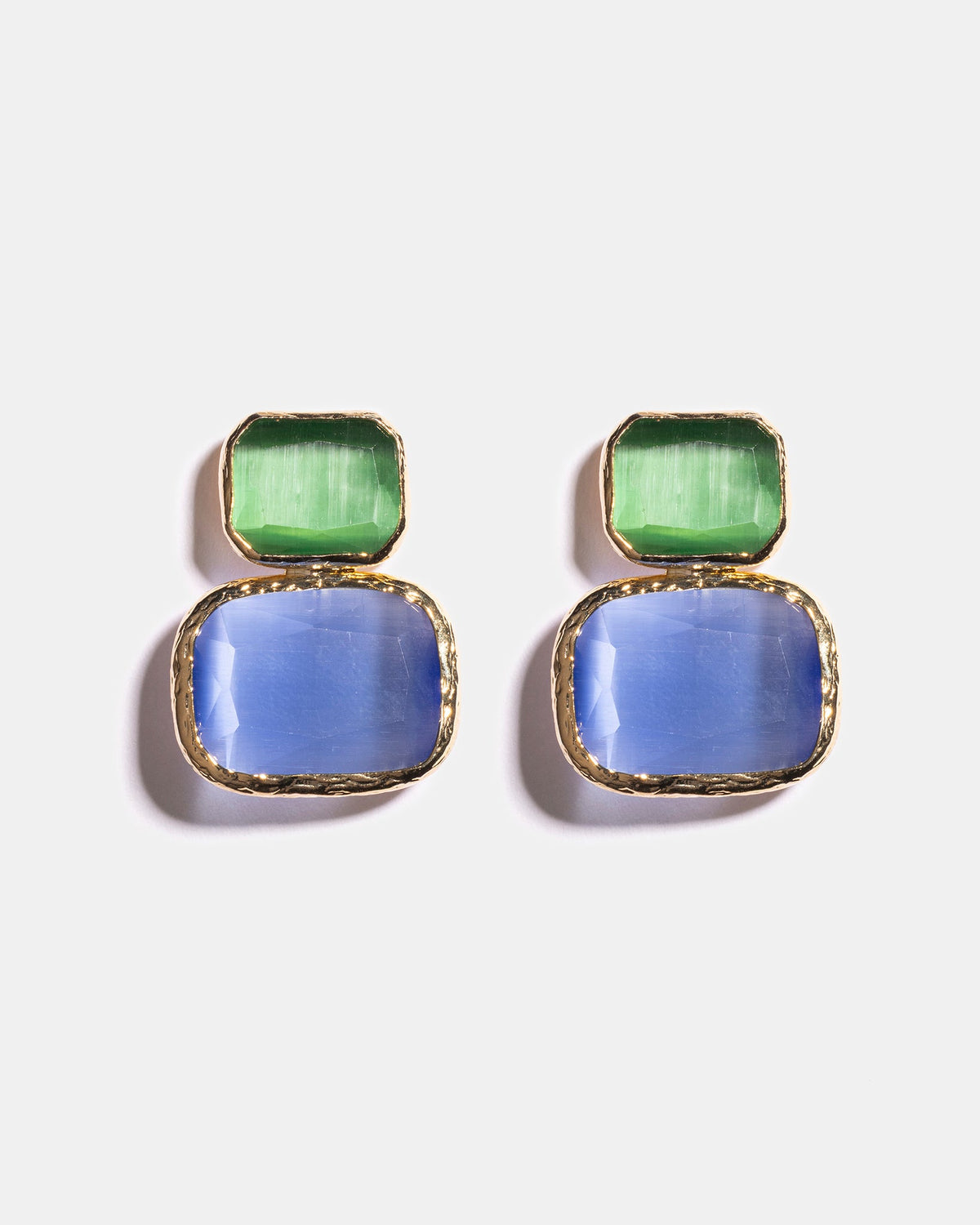Emerald and sky blue Cat’s Eye earrings flatlay