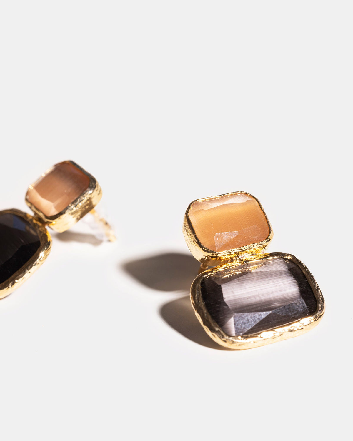 Dark and light contrast earrings close-up