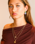 Model wearing emerald glow pendant necklace