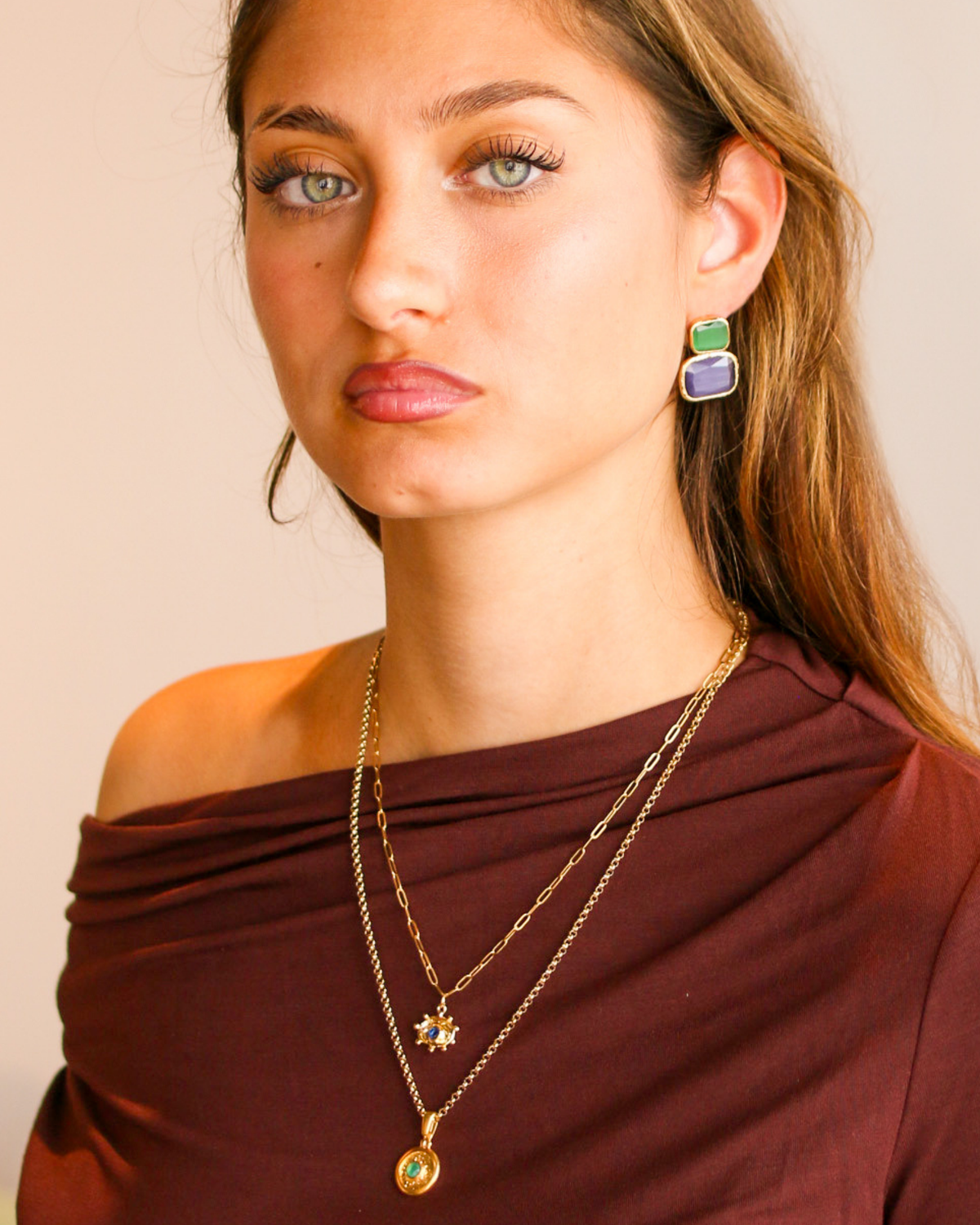 Model wearing emerald glow pendant necklace