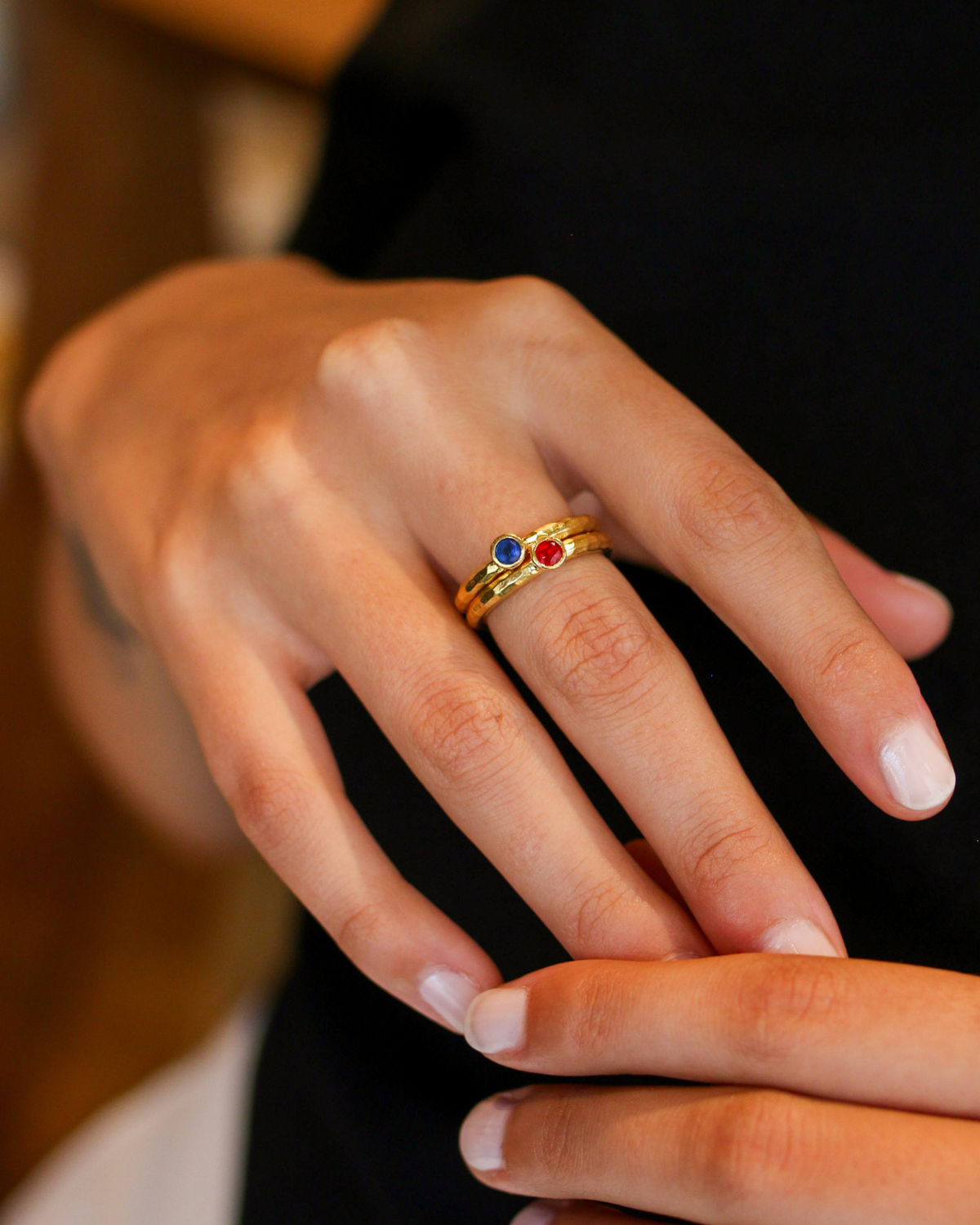 Sapphire gemstone ring worn on hand