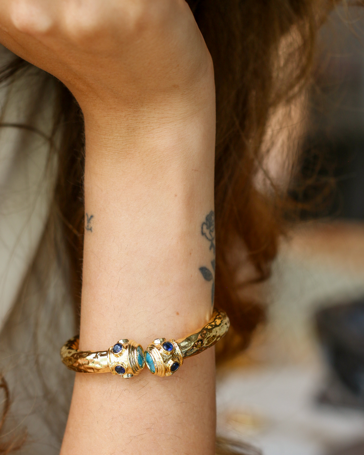 Gold zircon bracelet styled on wrist for everyday elegance