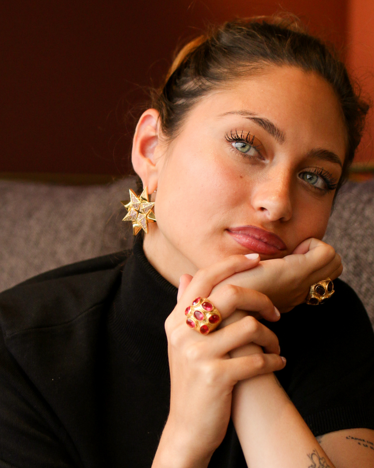 Close-up of pink gemstone cocktail ring on hand