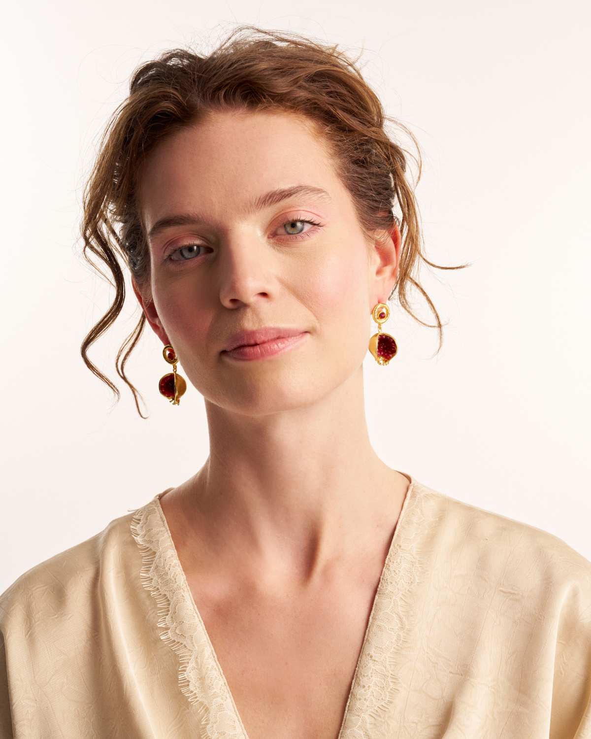 Portrait showcasing red jade earrings from a different angle