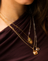 Eye motif sapphire pendant necklace on model
