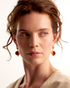 Model wearing red jade earrings with elegant minimal styling