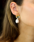 Sculptural pearl earrings detail