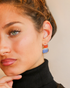 Vibrant gemstone earrings portrait