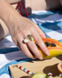 Woman wearing Lunar Pearl statement ring with modern celestial styling