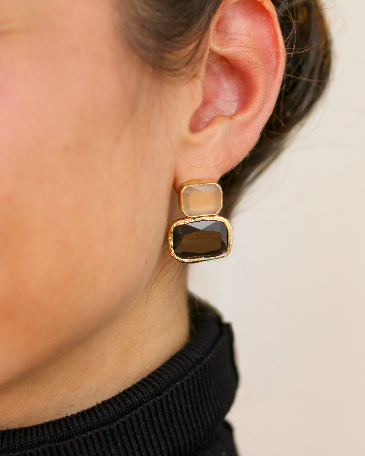 Modern gold-plated gemstone earrings editorial