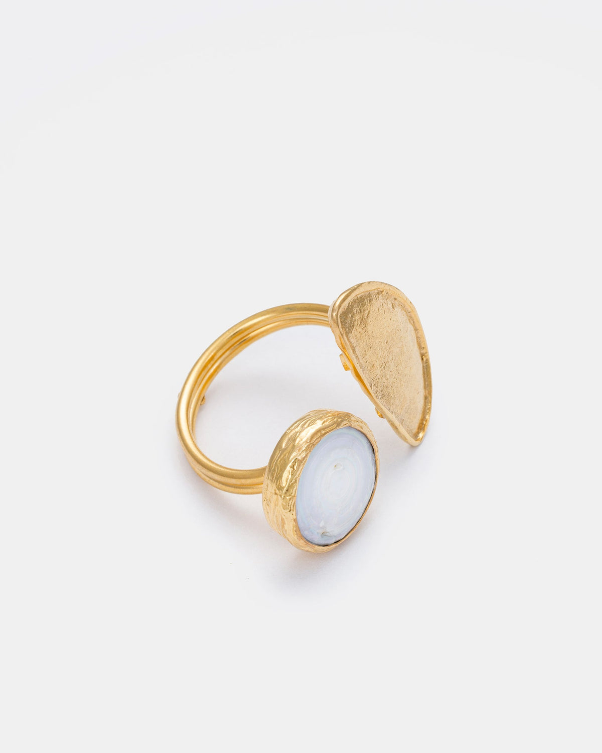 Side view of Lunar Pearl ring showcasing gold-plated finish and natural freshwater pearl
