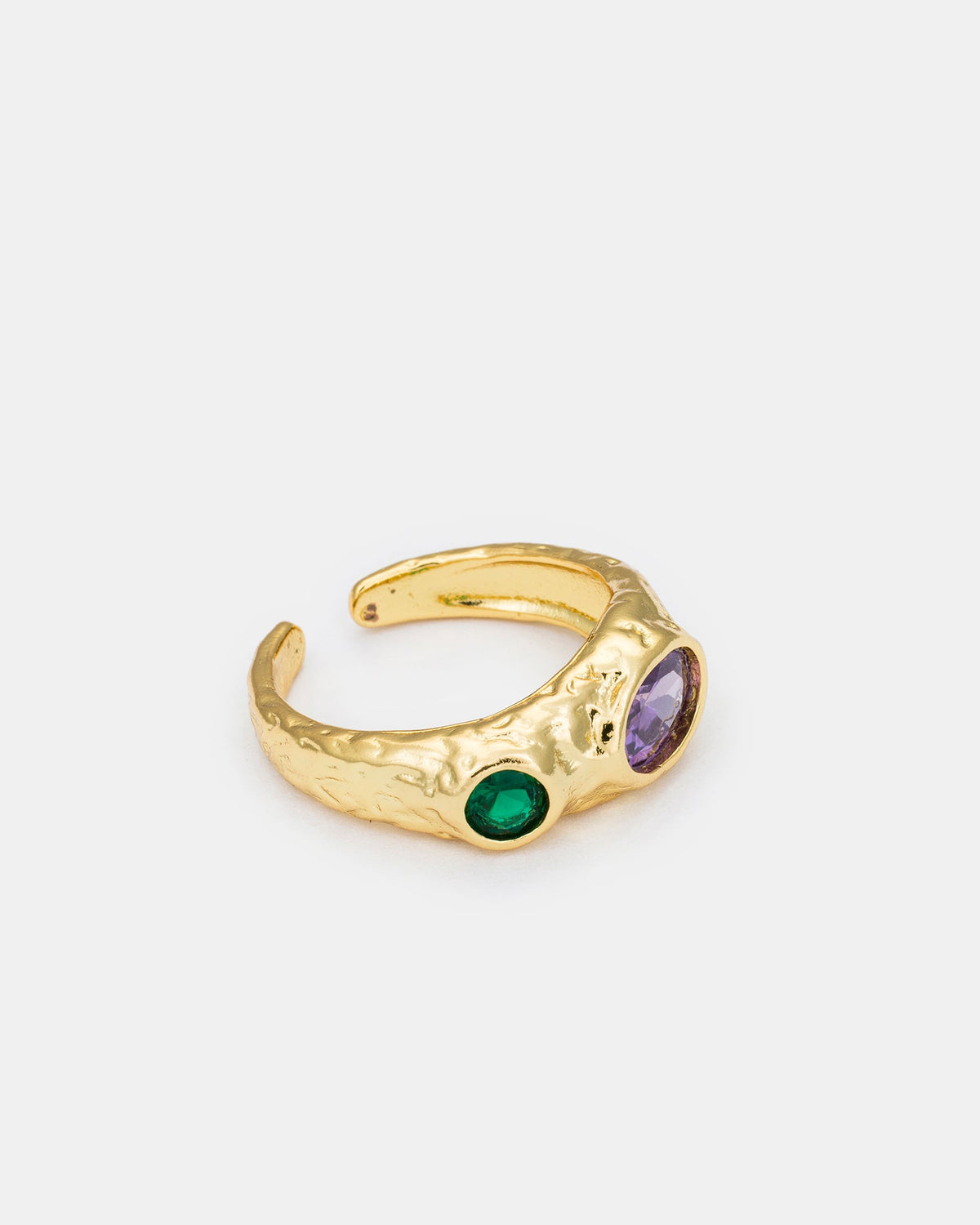 Close-up side view of gold-plated Celestial Glow ring highlighting zircon stone placement