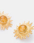 Close-up detail of celestial citrine earrings showing radiant sun-inspired design