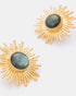 Close-up detail of gold sunburst earrings showcasing labradorite stones and radiant sunburst design