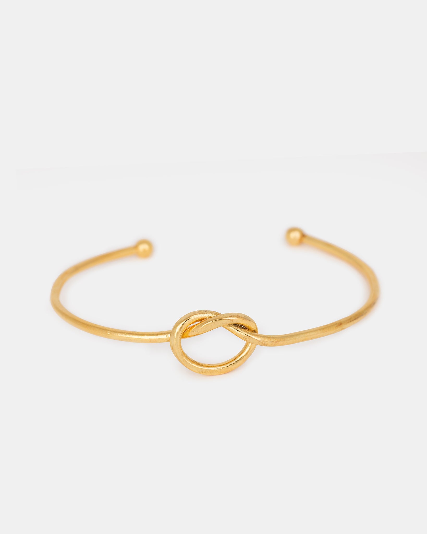 Gold-plated knot bangle bracelet with minimalist design
